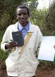 Enoce With His Bible And Certificate